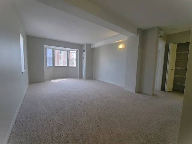 a view of empty room with windows