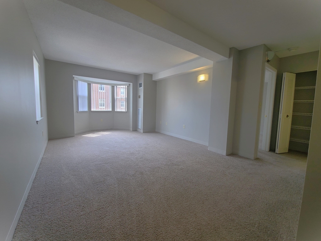 40 Westwind Road, Unit 657 Boston, MA 02125 - Photo 5 of 12 a view of empty room with windows