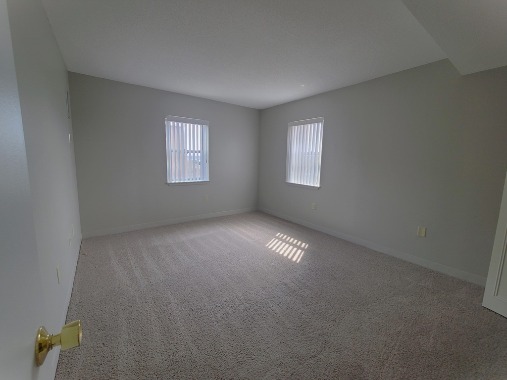 40 Westwind Road, Unit 657 Boston, MA 02125 - Photo 6 of 12 an empty room with a window