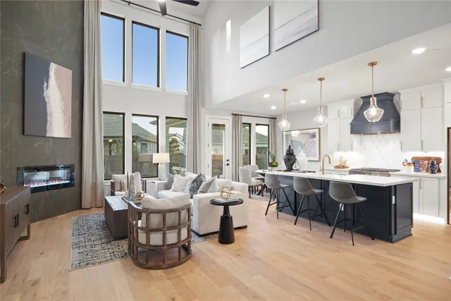 a large kitchen with a table and chairs in it