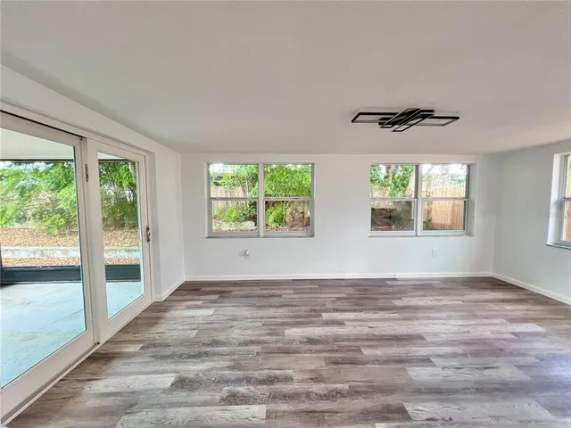 a view of an empty room with windows