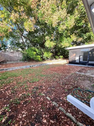 a backyard of a house with lots of green space