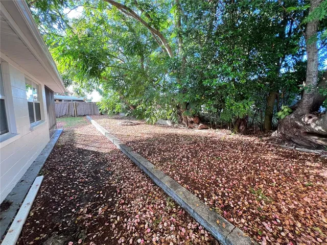 a view of a backyard of the house