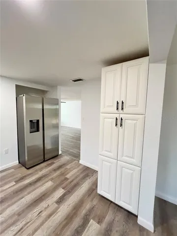 a view of a hallway with closet and entryway