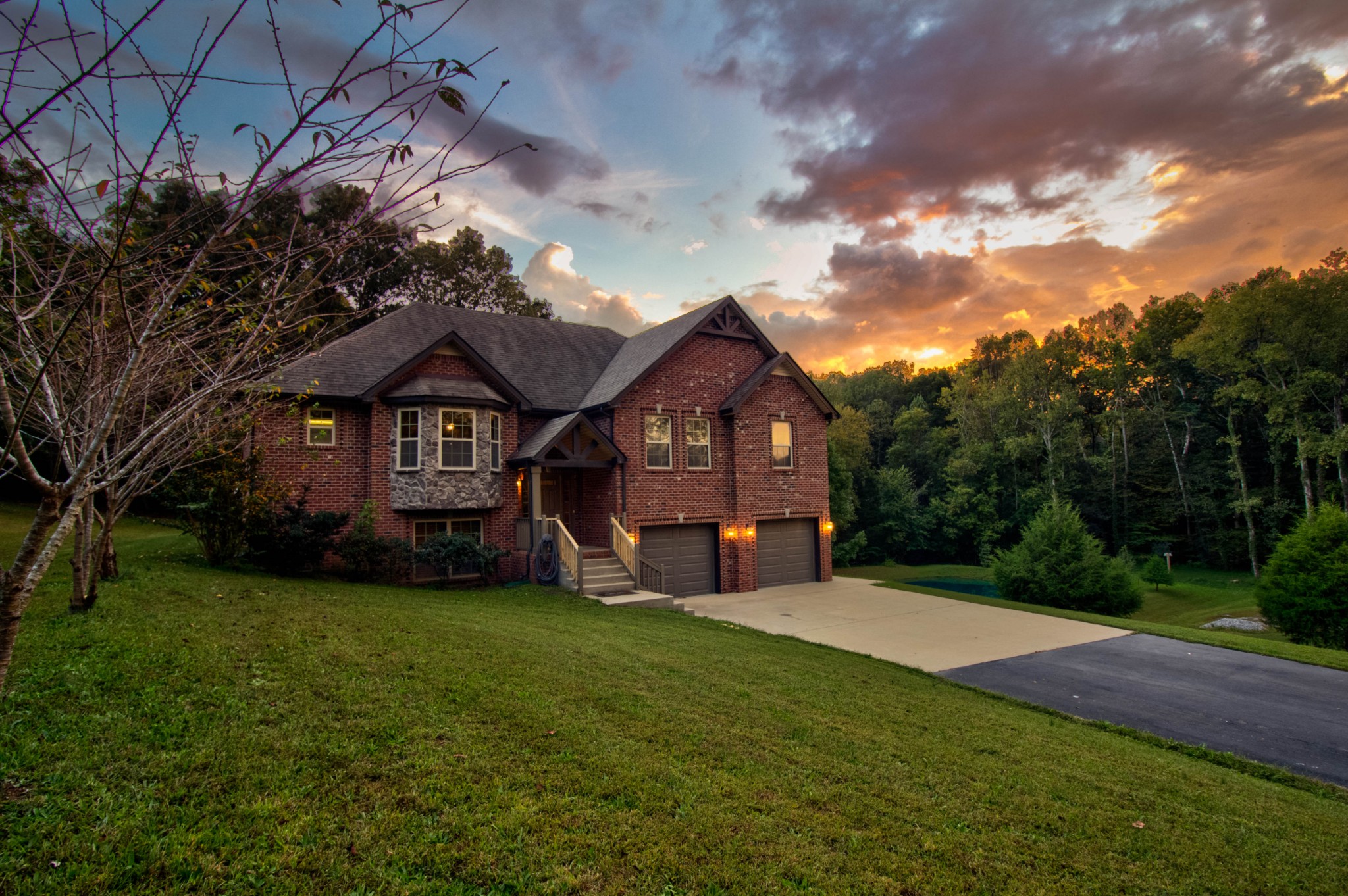 4190 Trough Springs Road Adams, TN 37010 - Photo 2 of 50 a front view of a house with a yard and garage