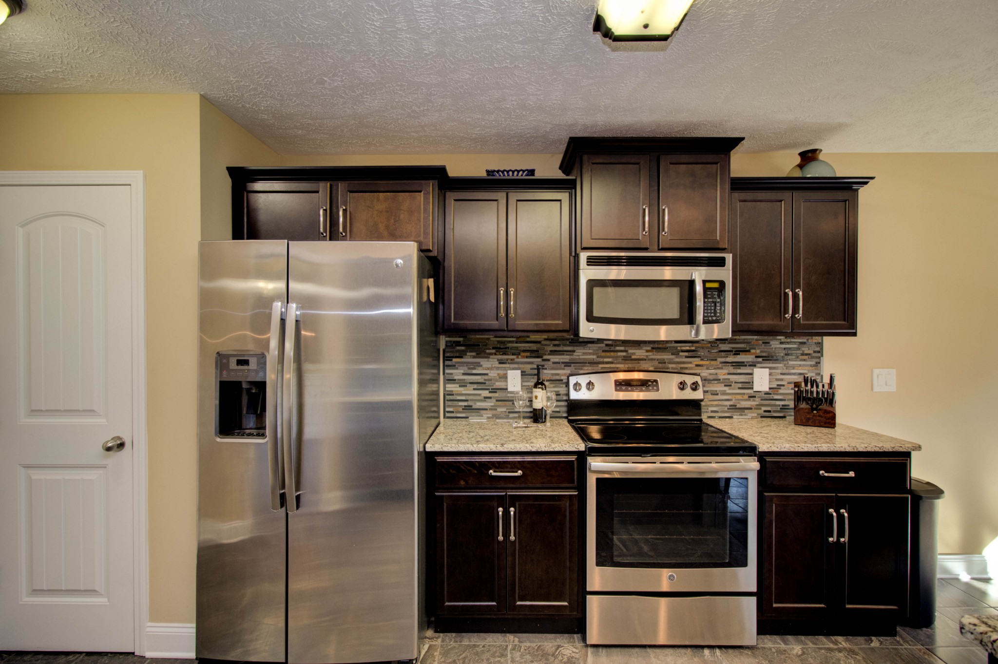 4190 Trough Springs Road Adams, TN 37010 - Photo 15 of 50 a kitchen with stainless steel appliances and refrigerator