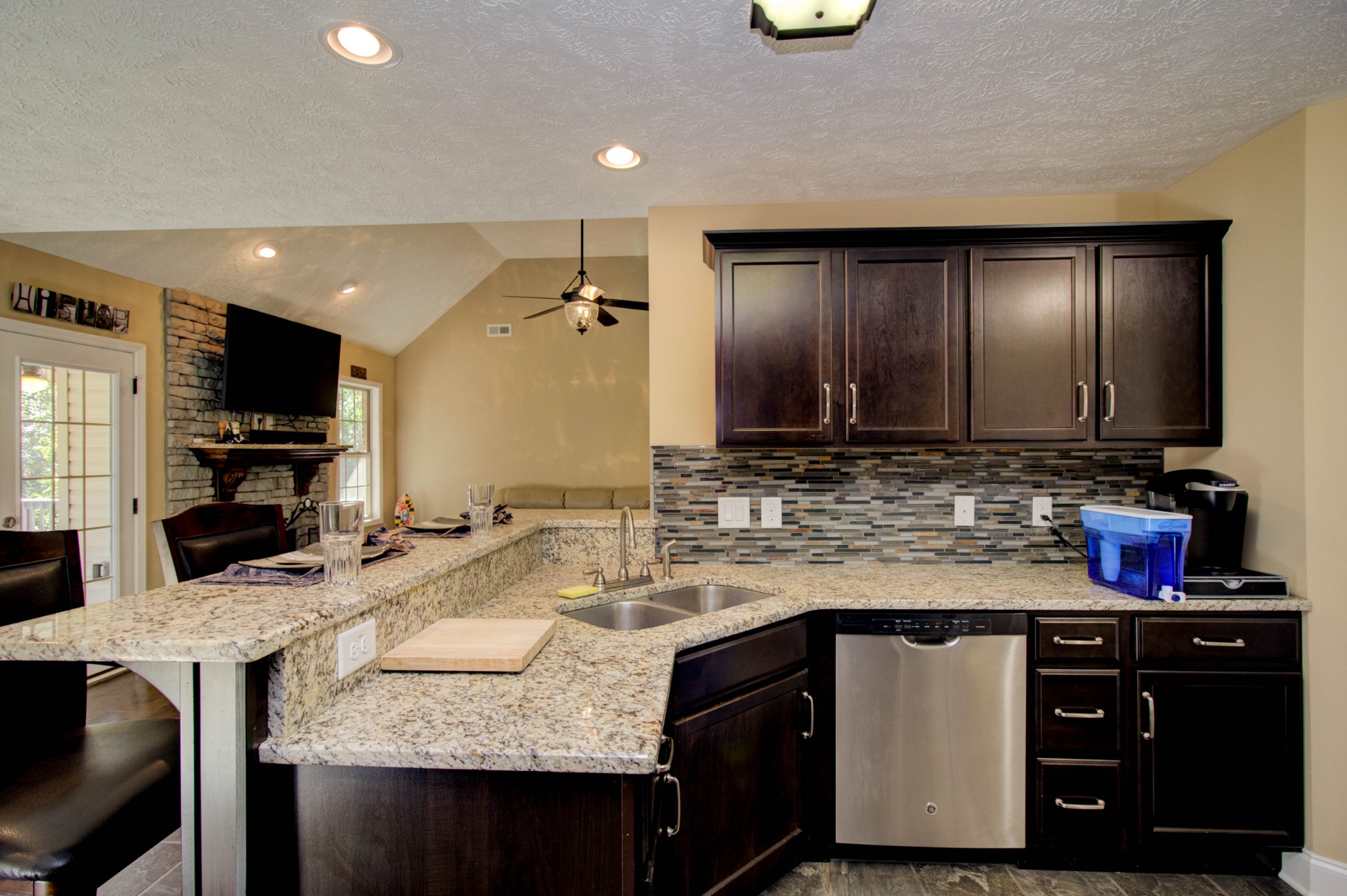4190 Trough Springs Road Adams, TN 37010 - Photo 16 of 50 a kitchen with granite countertop a sink and a stove