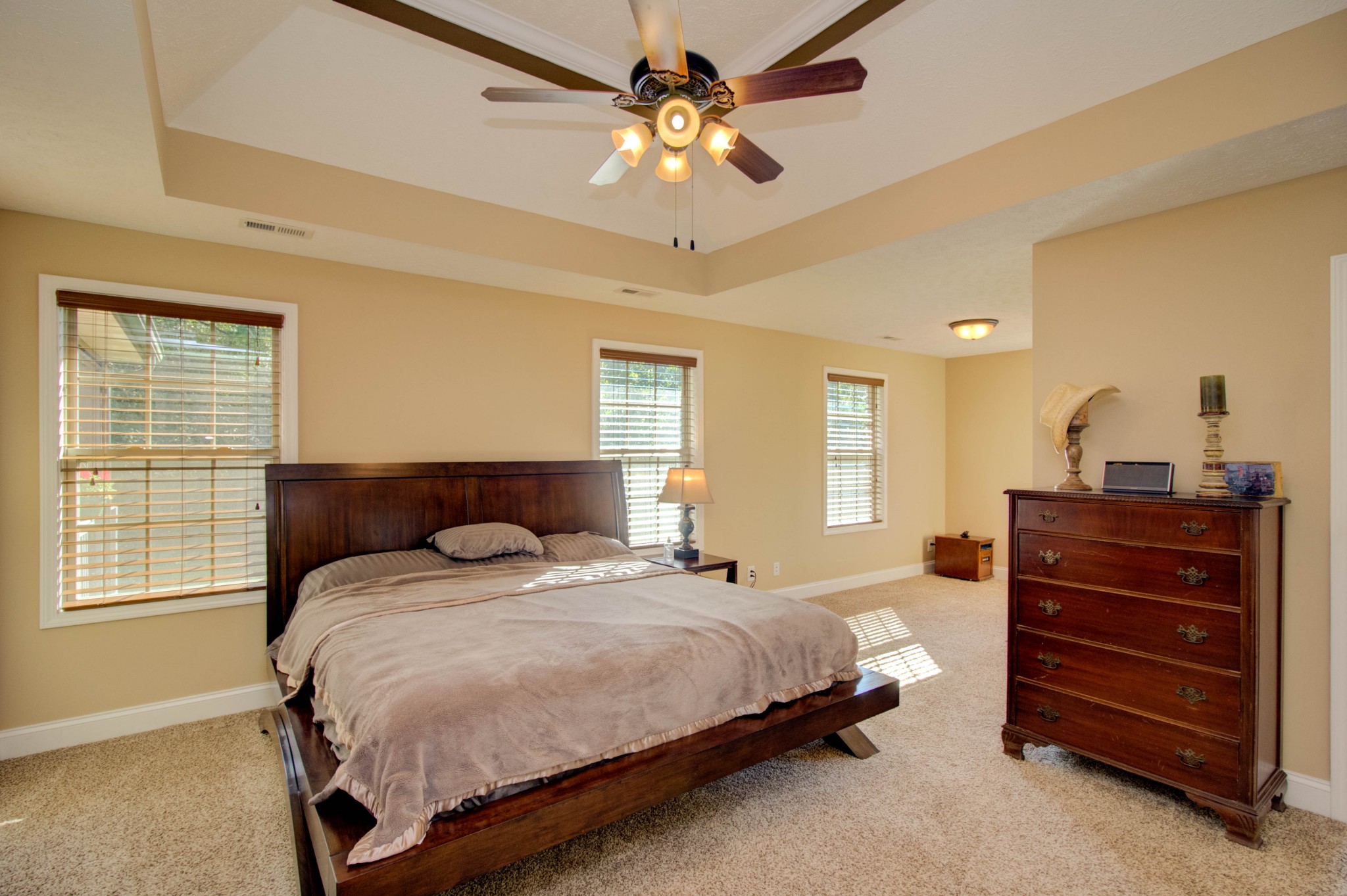 4190 Trough Springs Road Adams, TN 37010 - Photo 22 of 50 a bedroom with a bed and a chandelier