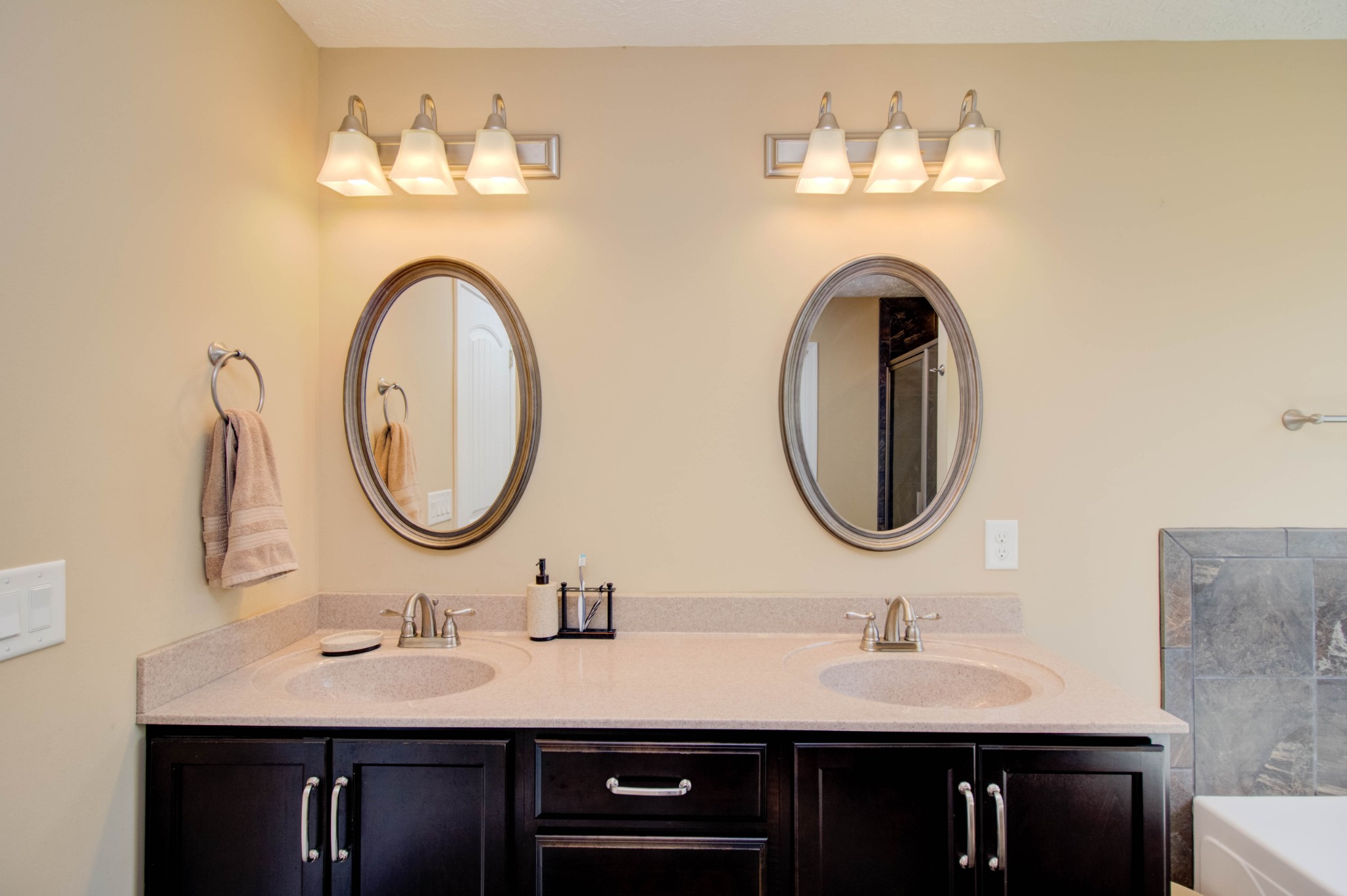 4190 Trough Springs Road Adams, TN 37010 - Photo 25 of 50 a bathroom with a granite countertop sink and a mirror