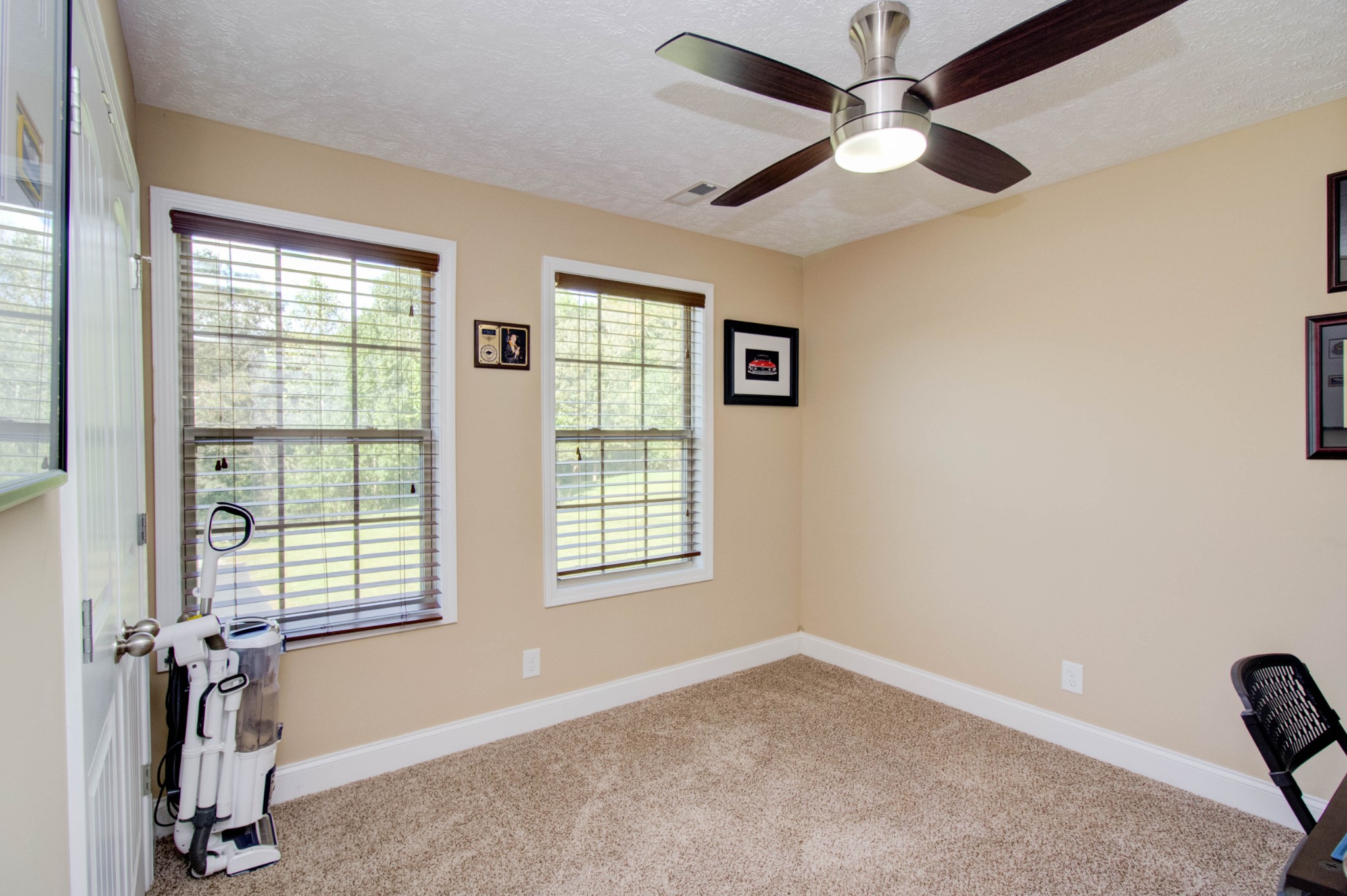 4190 Trough Springs Road Adams, TN 37010 - Photo 27 of 50 an empty room with windows and fan