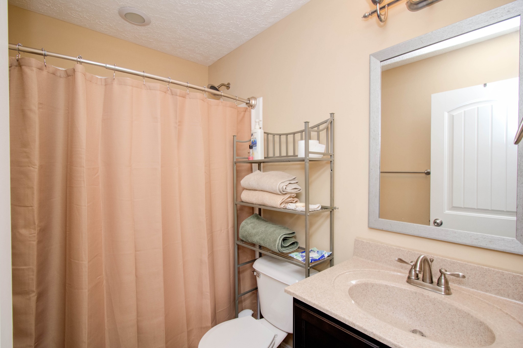 4190 Trough Springs Road Adams, TN 37010 - Photo 29 of 50 a bathroom with a sink and a mirror