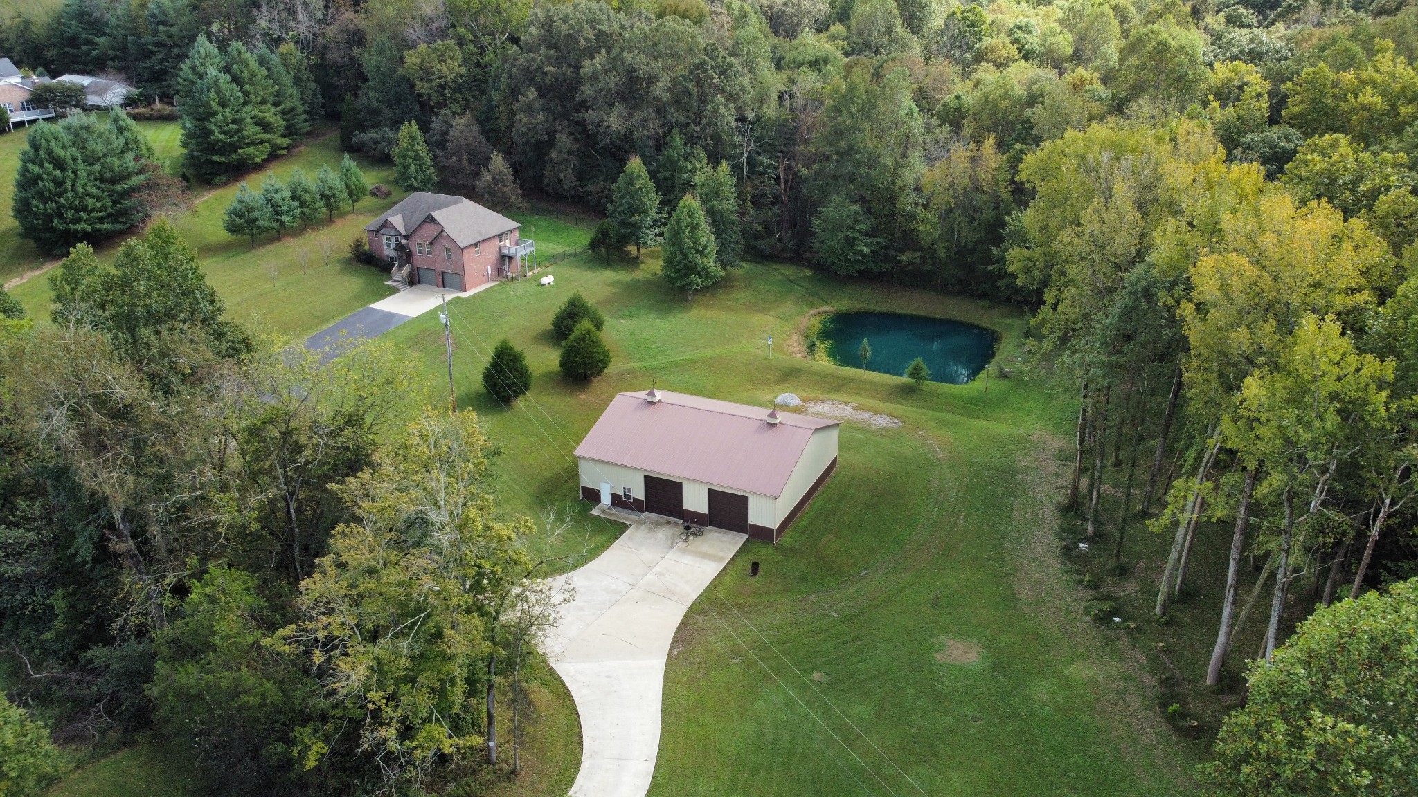 4190 Trough Springs Road Adams, TN 37010 - Photo 3 of 50 an aerial view of a house with a yard