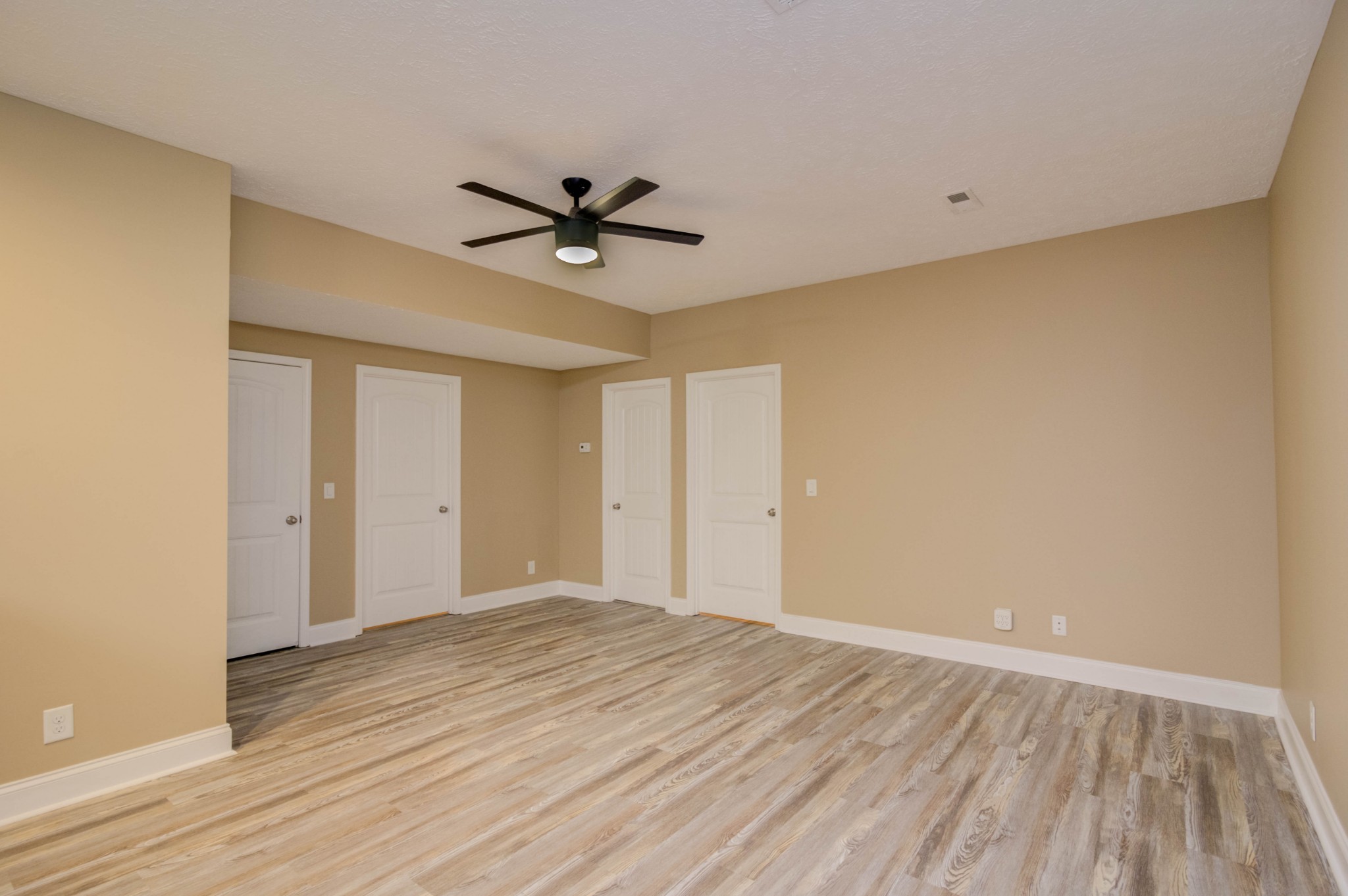 4190 Trough Springs Road Adams, TN 37010 - Photo 31 of 50 a view of room with wooden floor and ceiling fan
