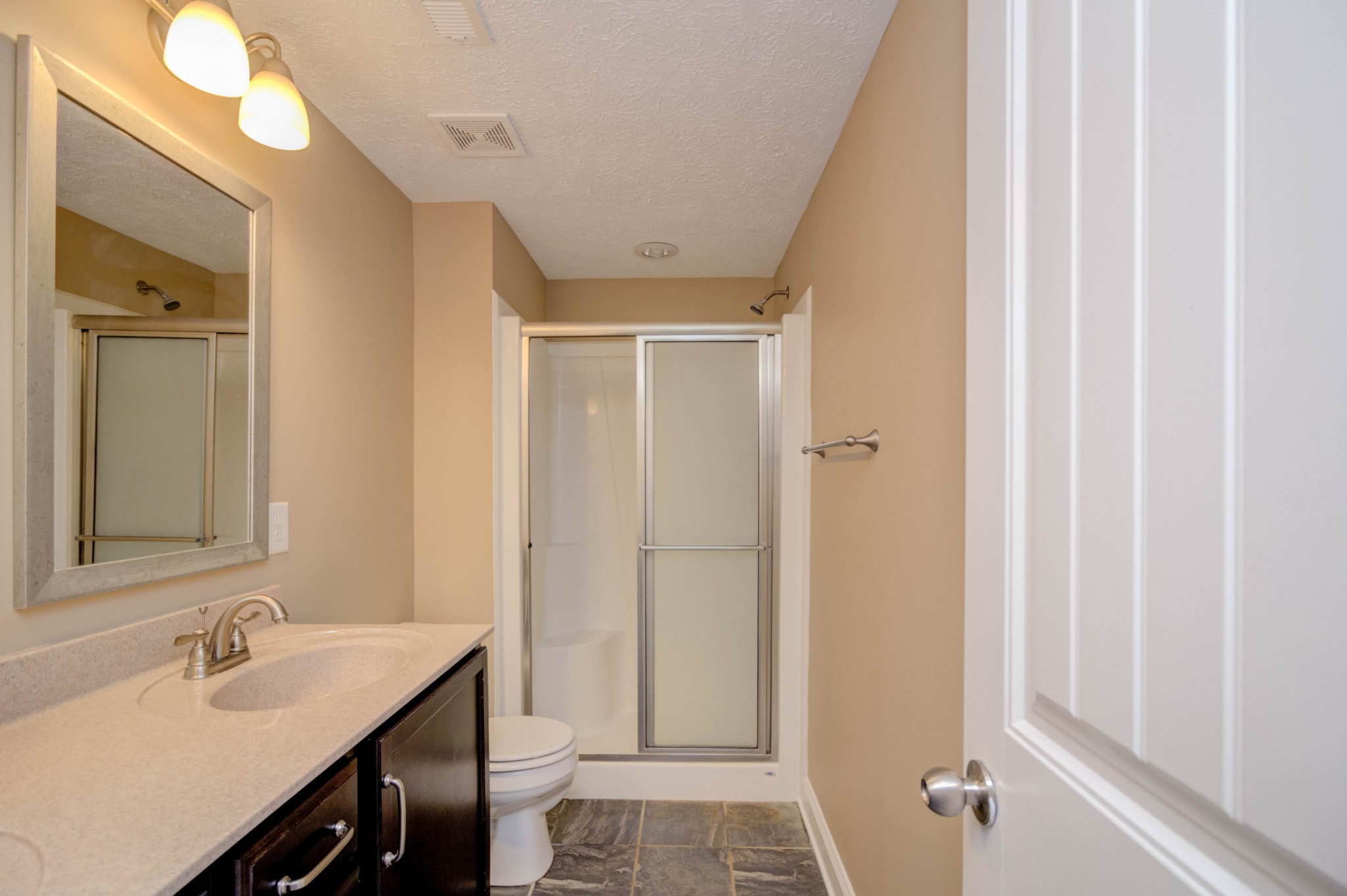 4190 Trough Springs Road Adams, TN 37010 - Photo 39 of 50 a bathroom with a sink and mirror with toilet