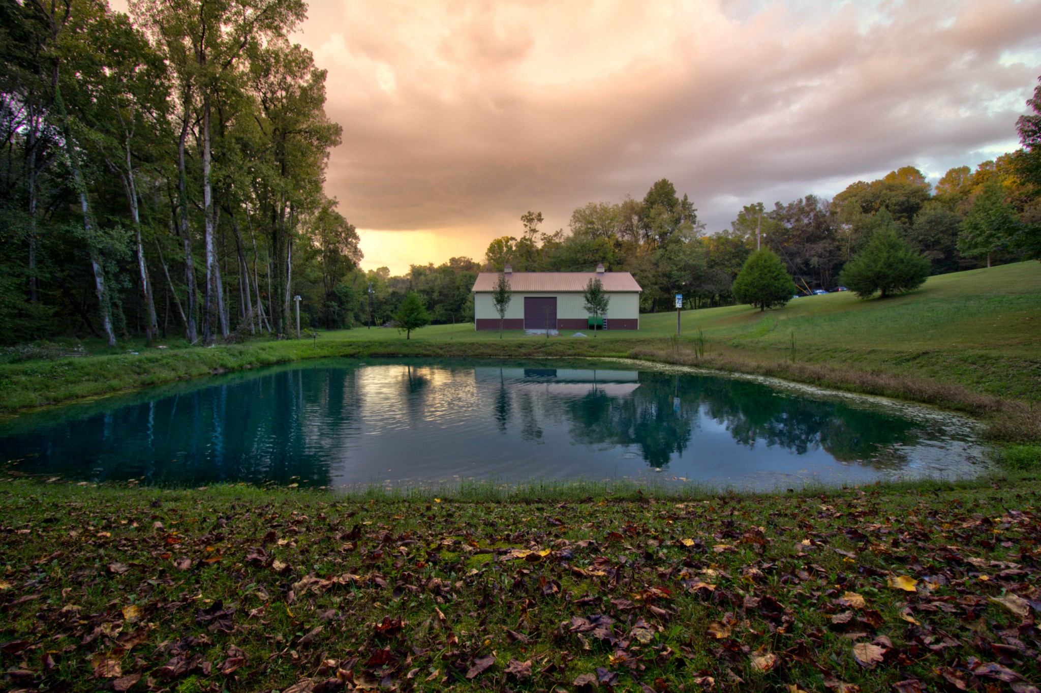 4190 Trough Springs Road Adams, TN 37010 - Photo 41 of 50 a view of a lake with a house in the background