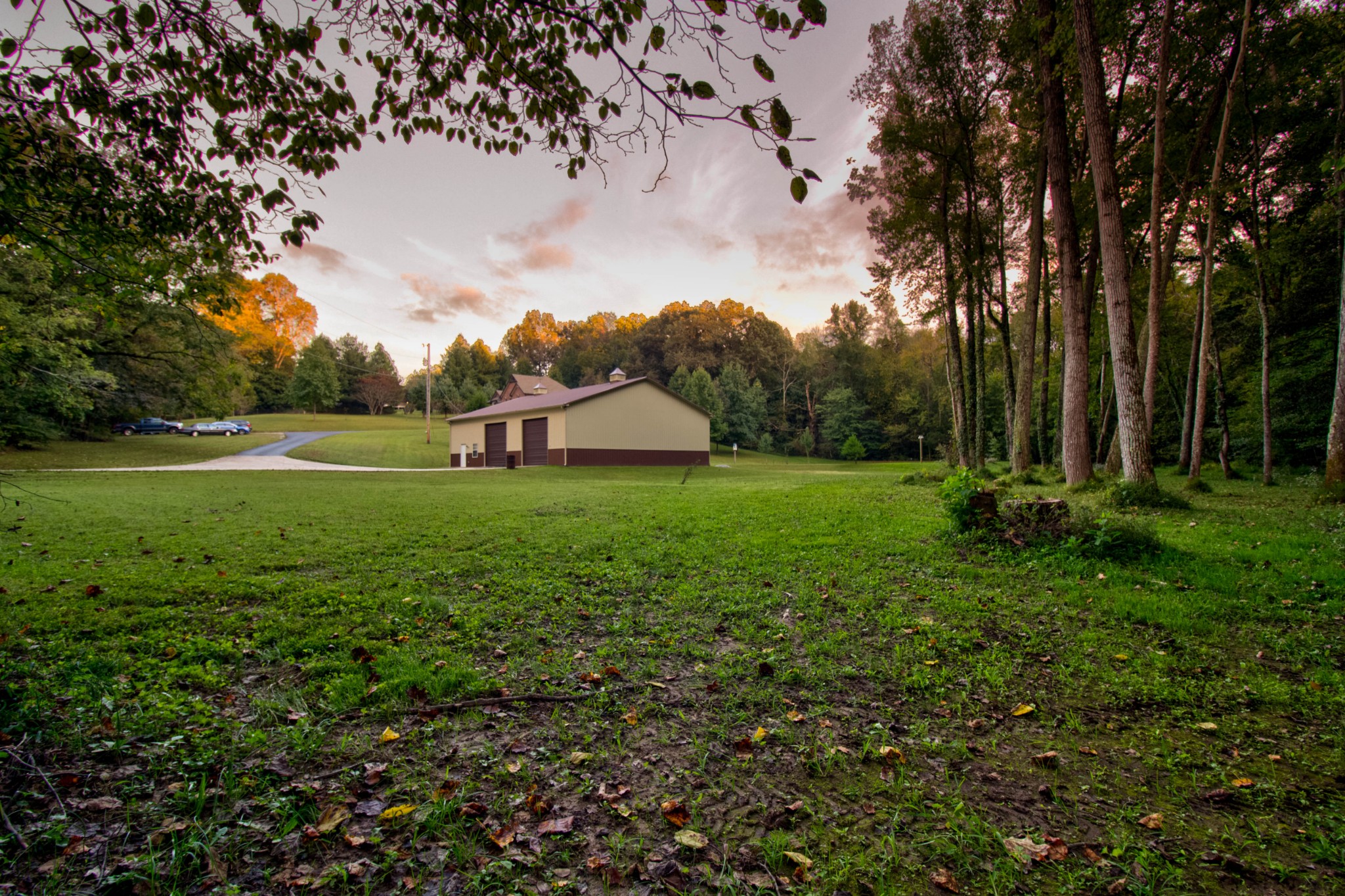 4190 Trough Springs Road Adams, TN 37010 - Photo 45 of 50 a view of a green field with wooden fence