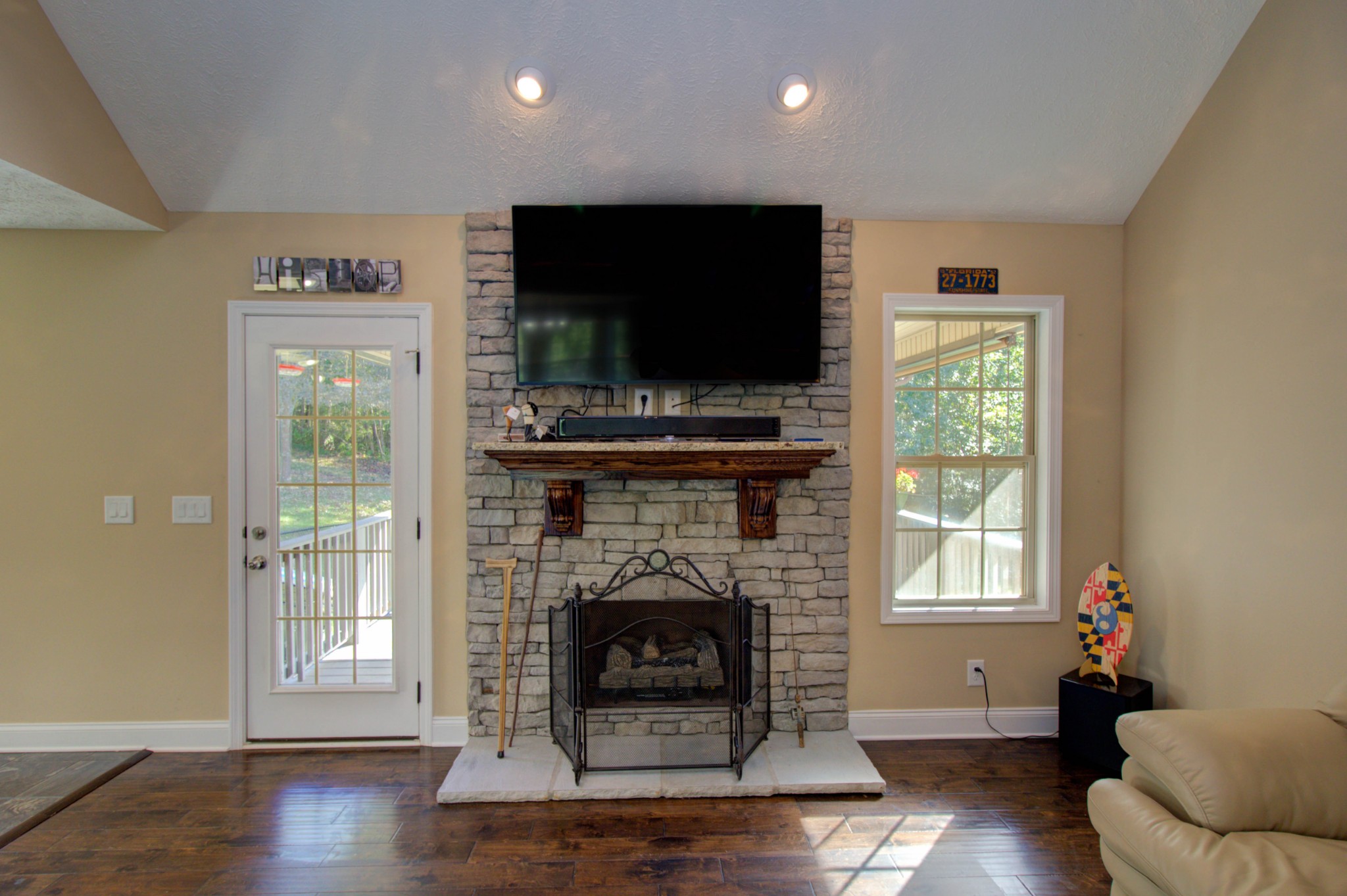 4190 Trough Springs Road Adams, TN 37010 - Photo 9 of 50 a living room with furniture a flat screen tv and a fireplace