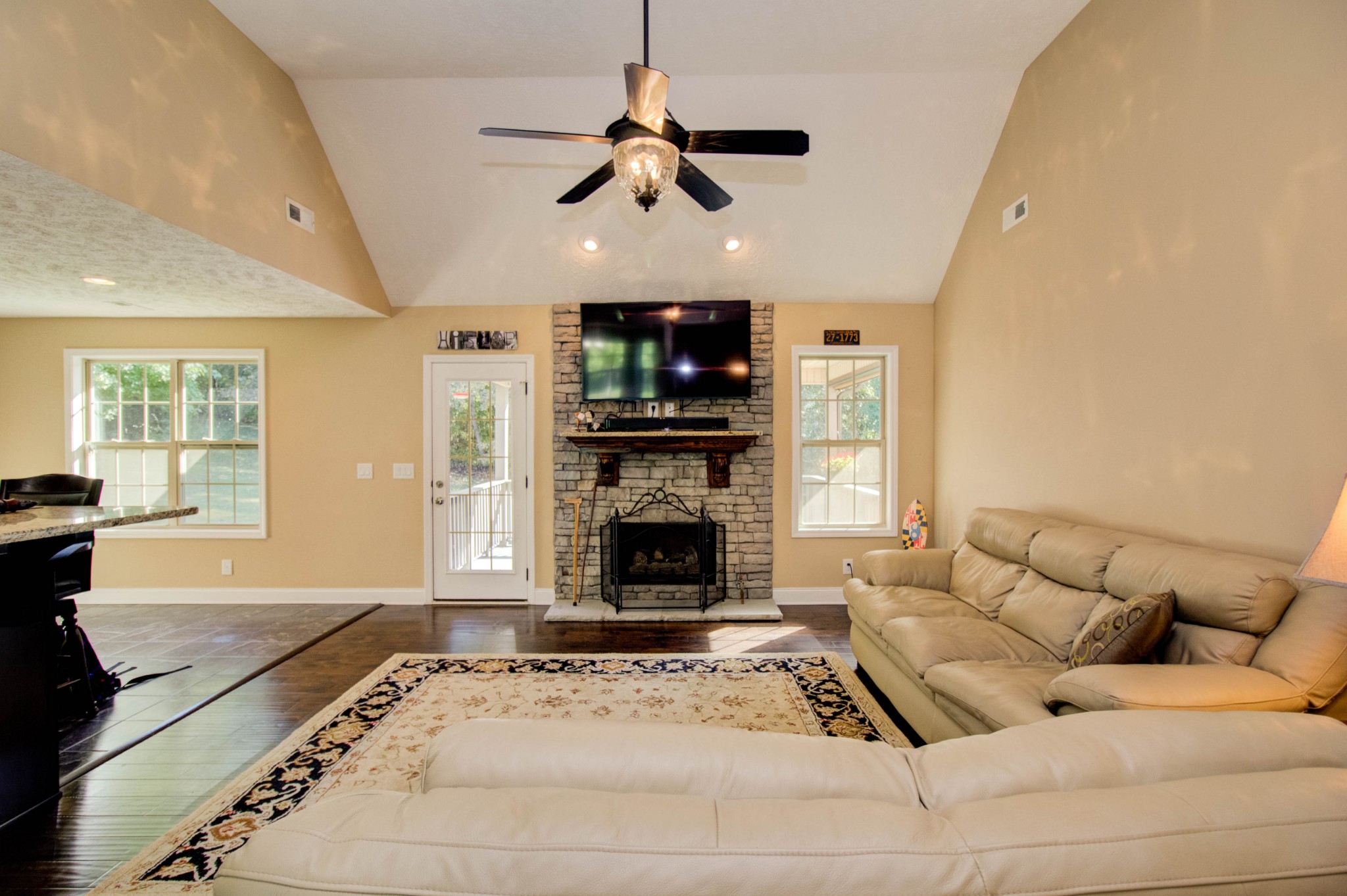 4190 Trough Springs Road Adams, TN 37010 - Photo 10 of 50 a living room with furniture a fireplace and a flat screen tv