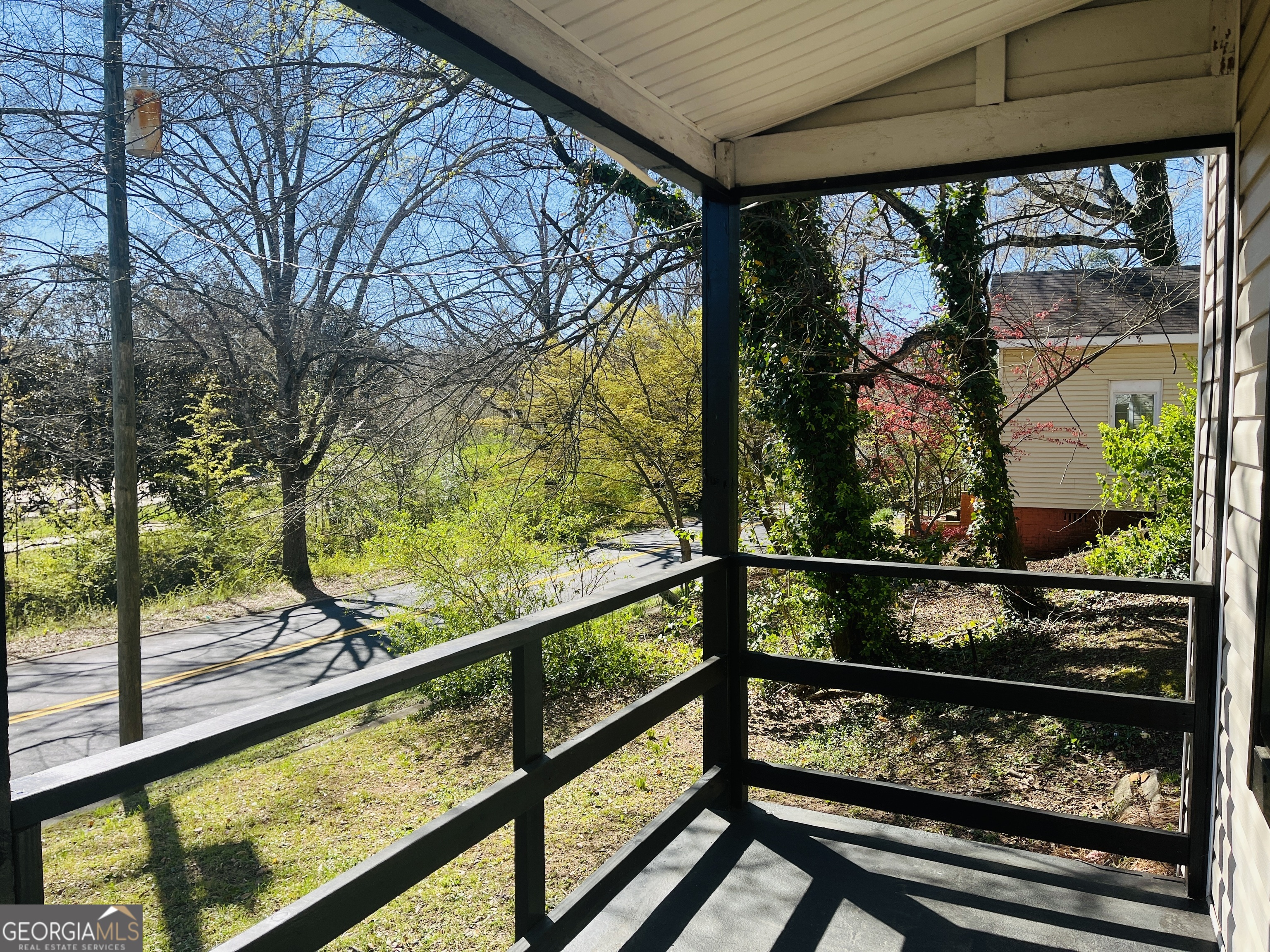 1318 Forrest Avenue LaGrange, GA 30240 - Photo 3 of 23 a view of trees and cars from a balcony