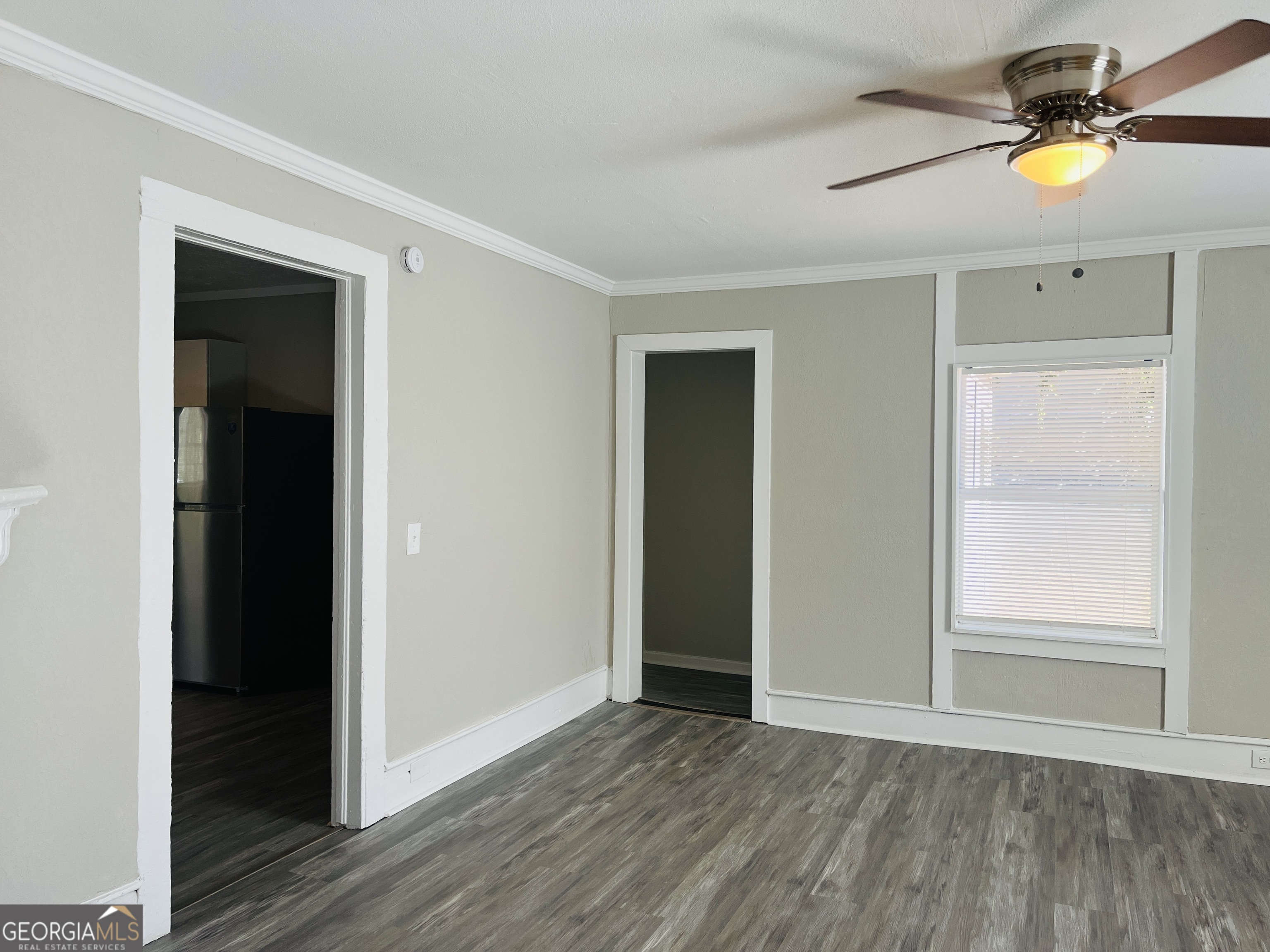 1318 Forrest Avenue LaGrange, GA 30240 - Photo 4 of 23 wooden floor in an empty room with a window