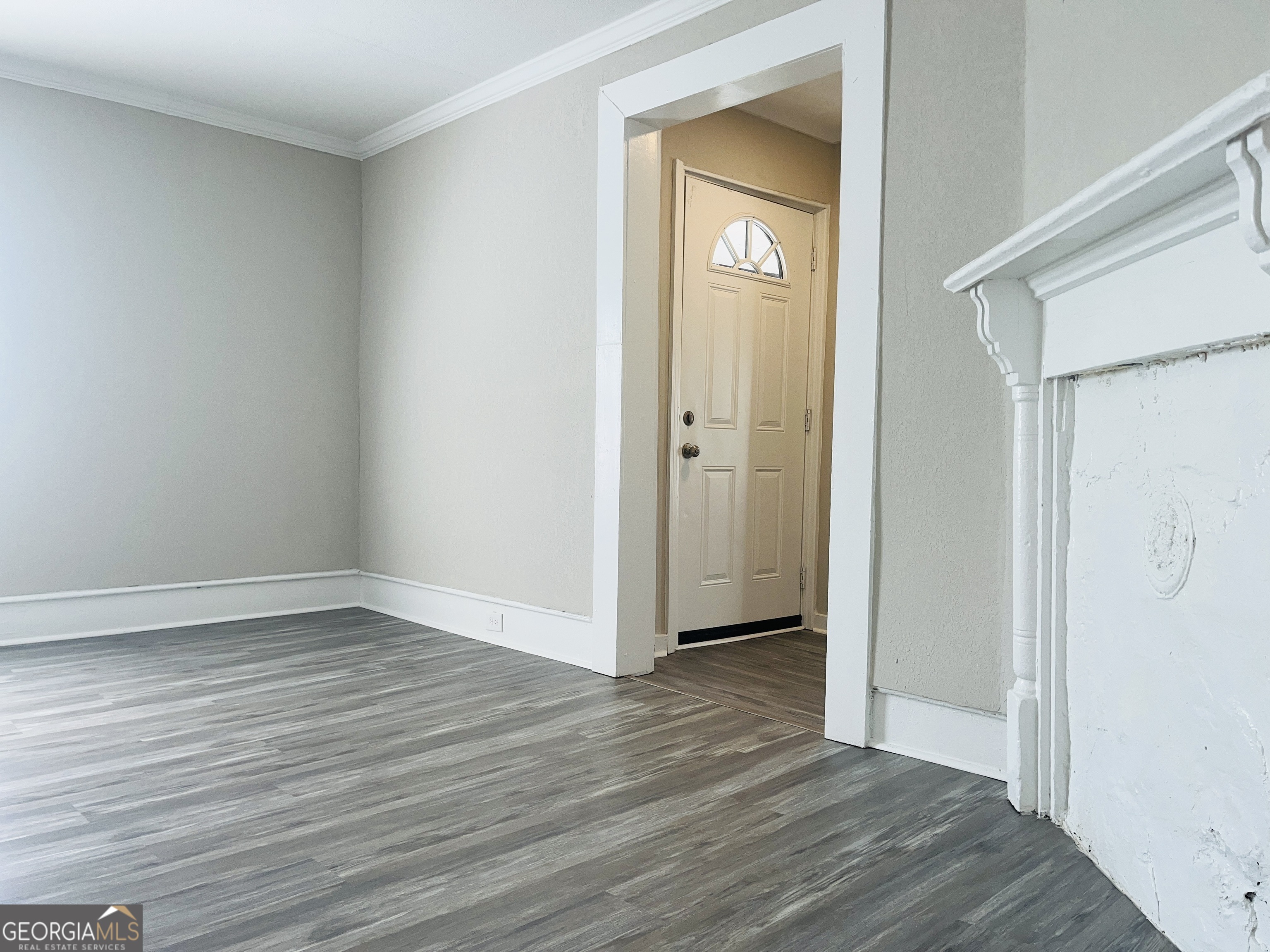 1318 Forrest Avenue LaGrange, GA 30240 - Photo 7 of 23 a view of an empty room with closet and wooden floor