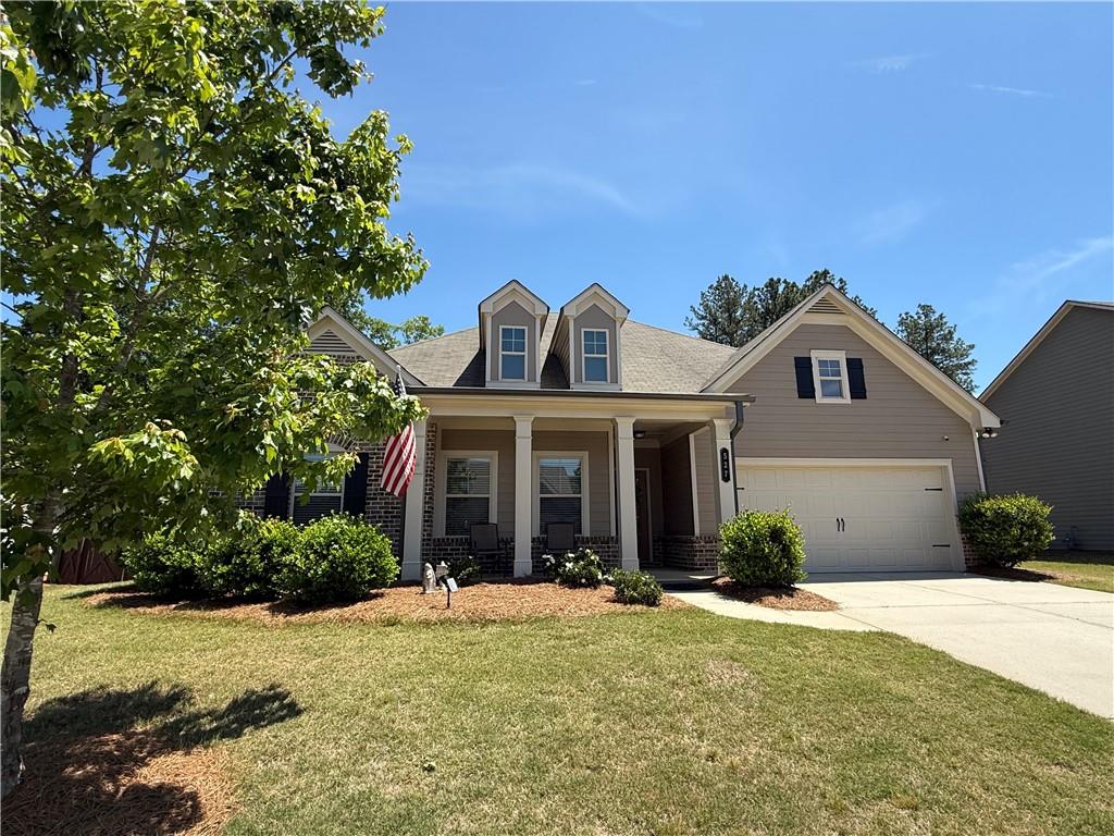 527 Gadwall Circle Jefferson, GA 30549 - Photo 1 of 42 a front view of a house with a yard and garage