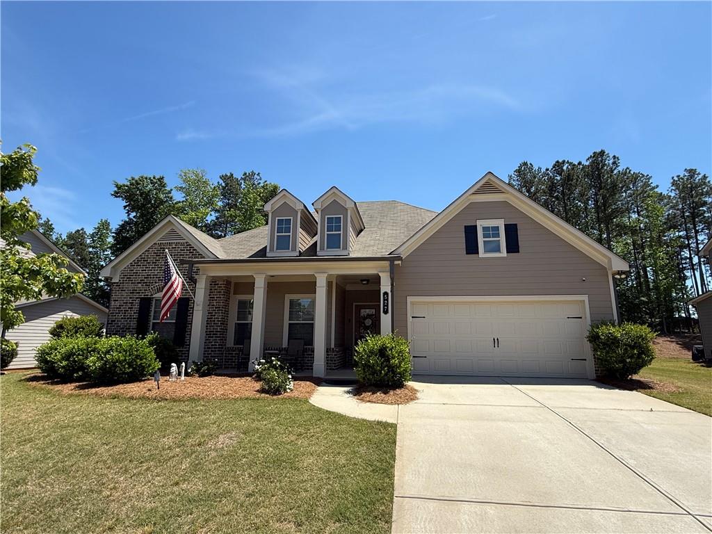 527 Gadwall Circle Jefferson, GA 30549 - Photo 2 of 42 a front view of a house with a yard and garage