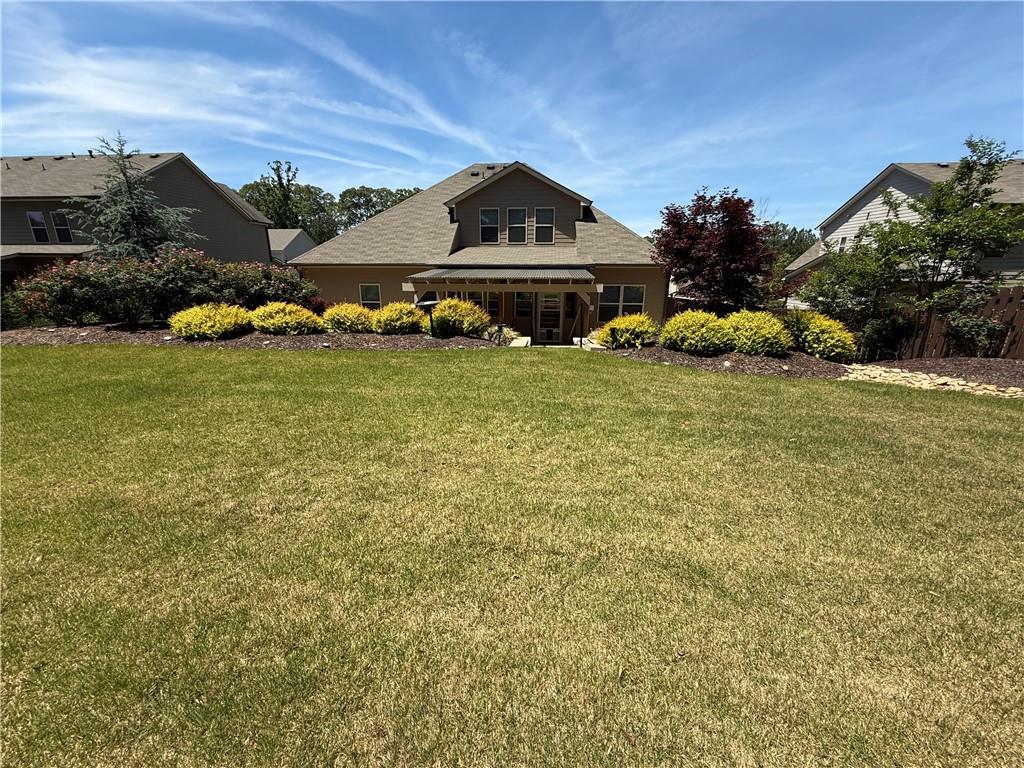 527 Gadwall Circle Jefferson, GA 30549 - Photo 39 of 42 a front view of a house with a garden
