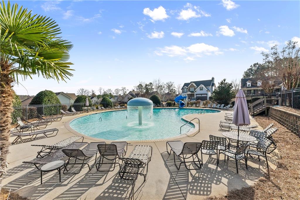 527 Gadwall Circle Jefferson, GA 30549 - Photo 41 of 42 a view of a swimming pool with a patio and a yard