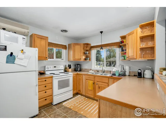 a kitchen with a dining table and chairs