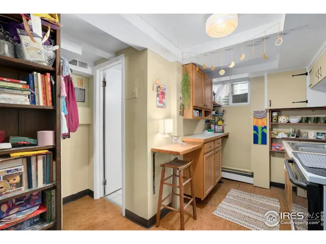 a kitchen with a sink cabinets and window