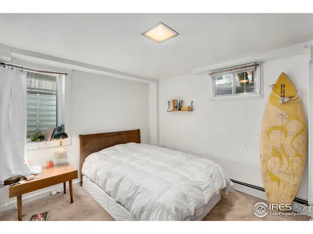 a bathroom with a toilet sink and a mirror