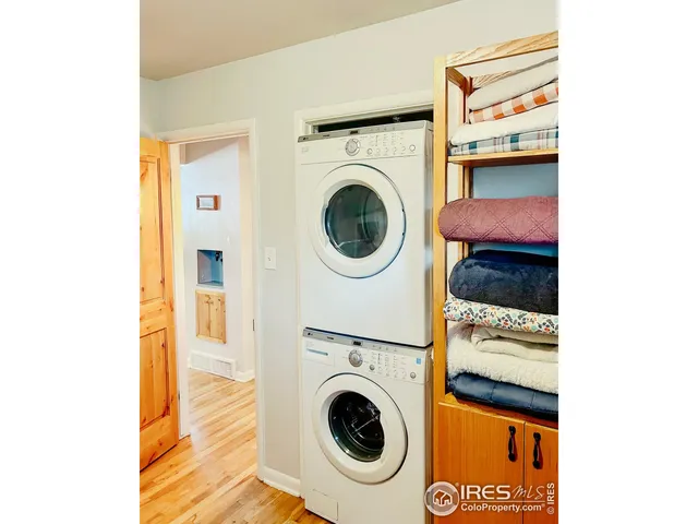 a bedroom with a bed and a mirror