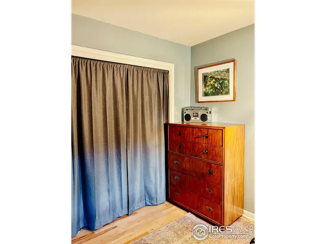 a view of a bedroom with a bed and a couch