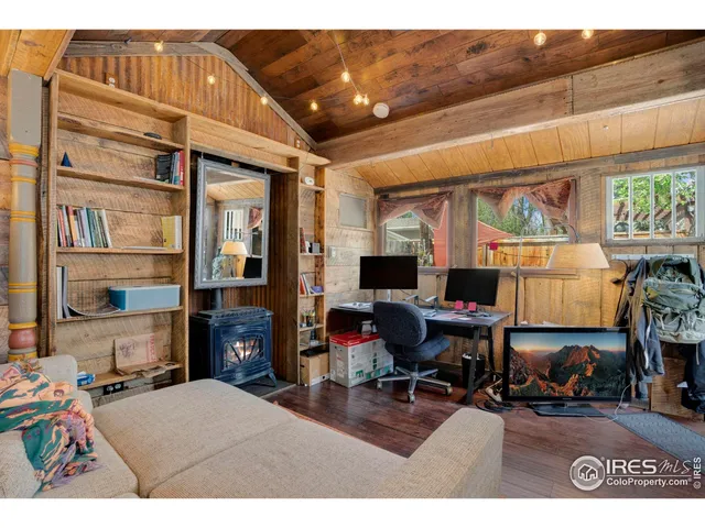 a bedroom with furniture and a fireplace