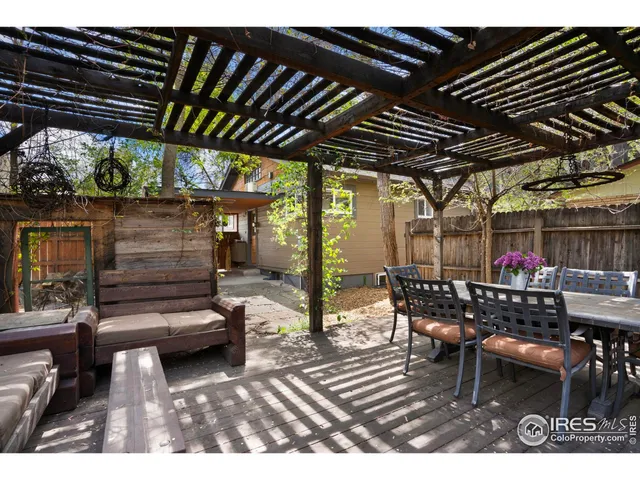 a view of a backyard with sitting area