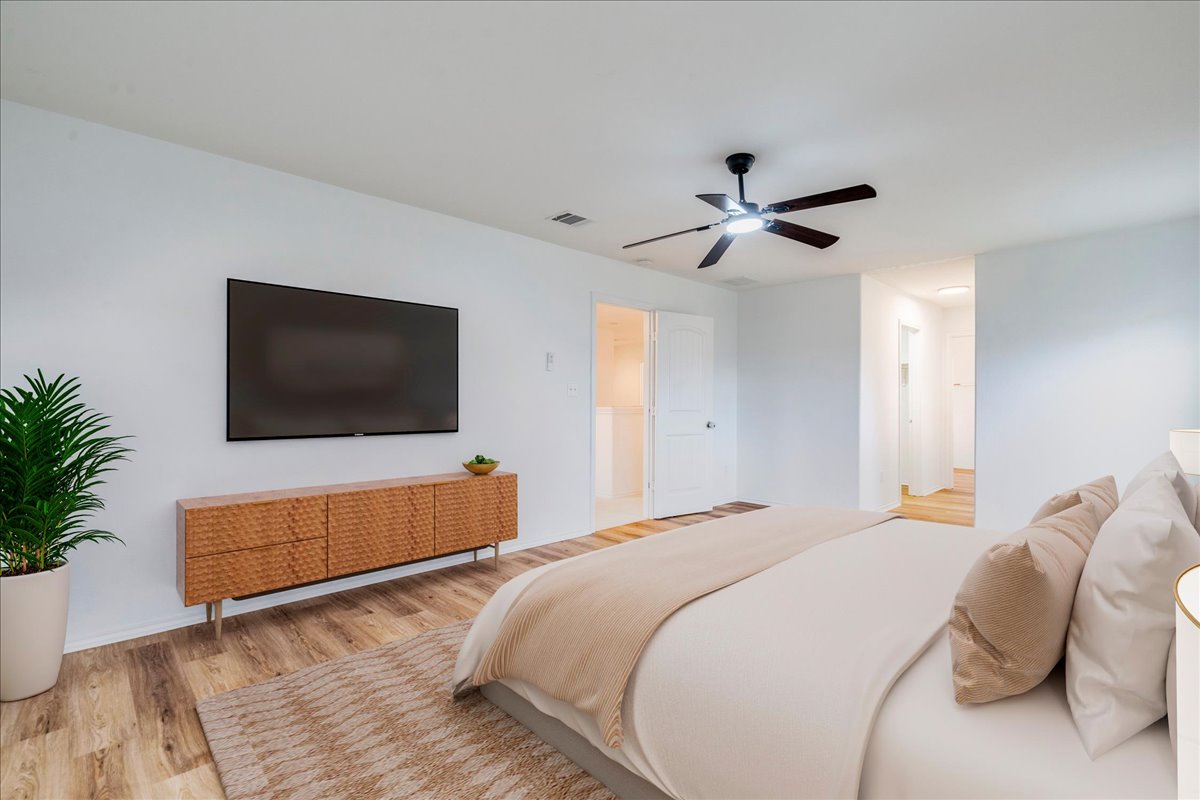 401 Waterleaf Boulevard Kyle, TX 78640 - Photo 13 of 28 Primary bedroom with new floors