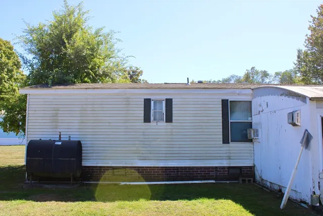 a view of a house with a backyard