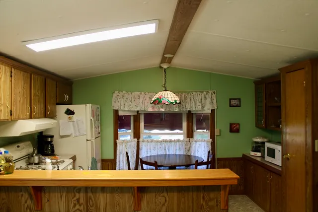 a bathroom with a sink a large mirror and a shower