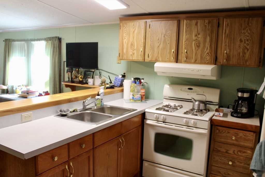 75 South Street, Unit 3 Bernardston, MA 01337 - Photo 9 of 20 a kitchen with a sink stove and cabinets