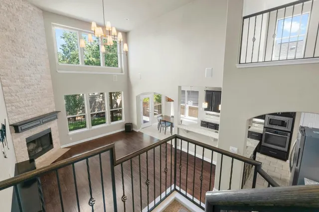 a view of a living room with furniture window and wooden floor