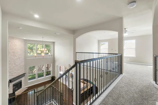 a view of a hallway with windows