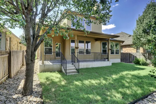 a view of a house with a yard porch and sitting area