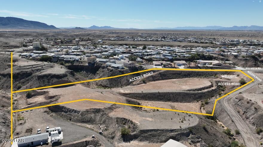 31753 Rio Vista Road Parker, AZ 85344 - Photo 1 of 9 a view of a swimming pool with a mountain