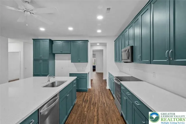 a bathroom with a sink a large mirror and a shower