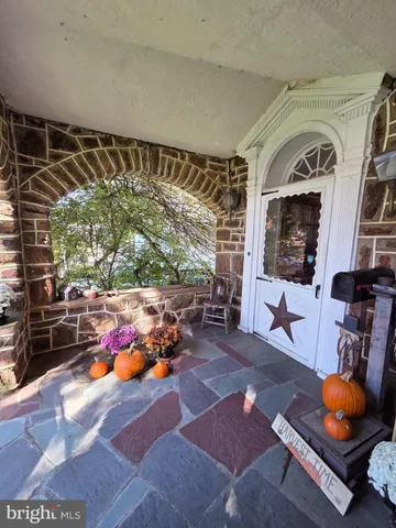 a living room with furniture a rug and a table