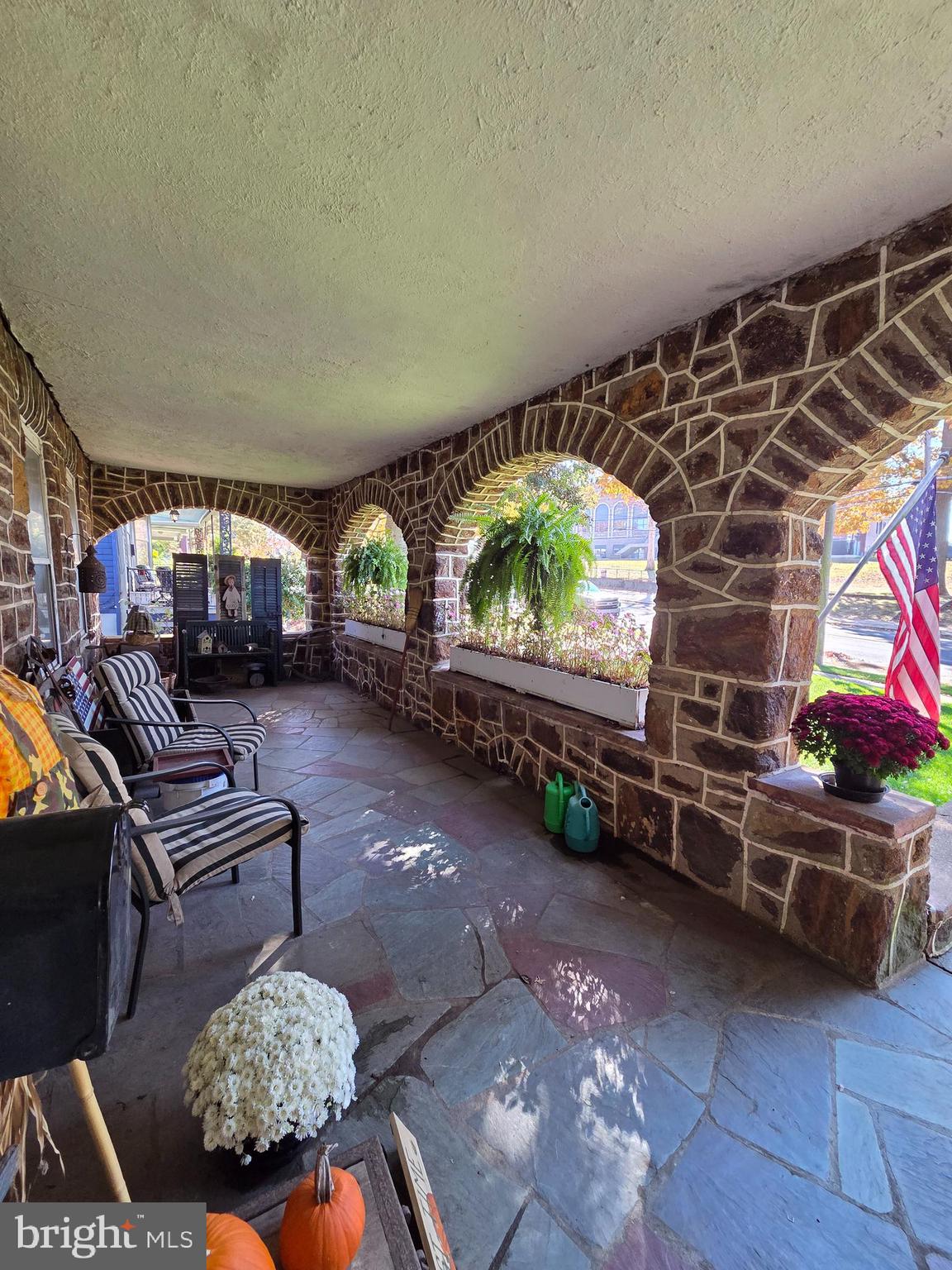 225 West Commerce Street Bridgeton, NJ 08302 - Photo 3 of 19 a living room with furniture and a flat screen tv