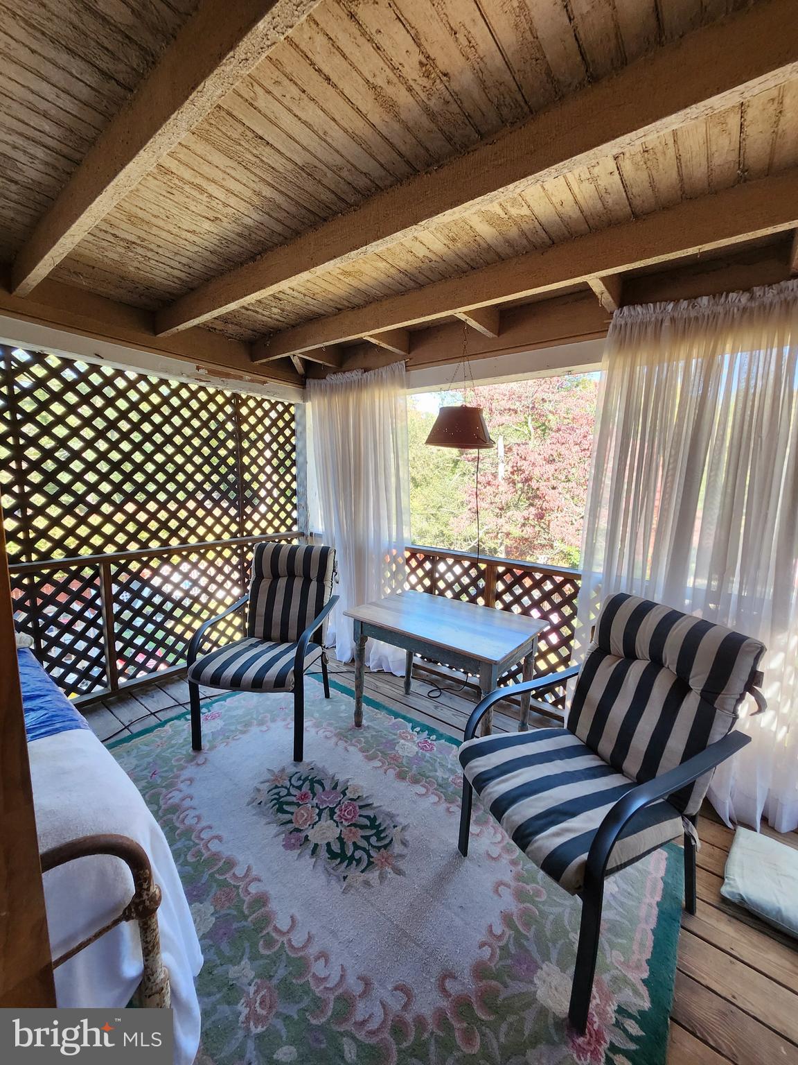 225 West Commerce Street Bridgeton, NJ 08302 - Photo 9 of 19 a outdoor living space with furniture and a rug