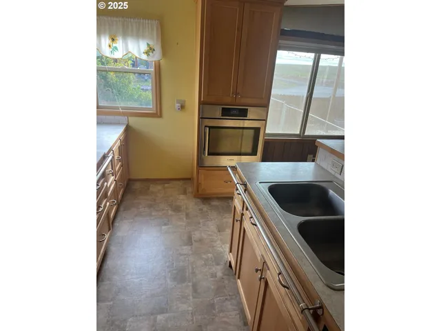 a hallway with sink and mirror