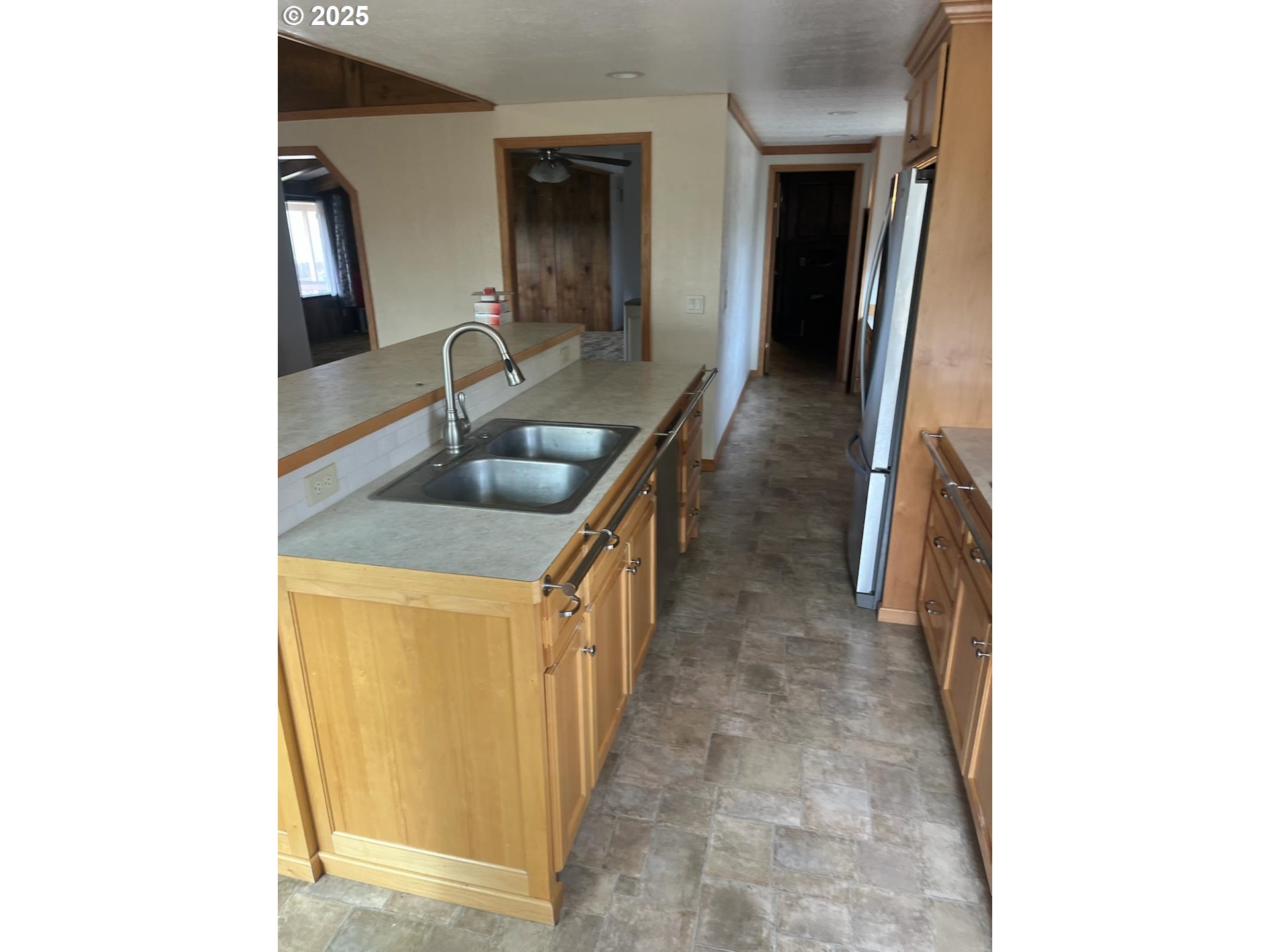 355 West Washington Street Athena, OR 97813 - Photo 13 of 32 a hallway with sink and mirror